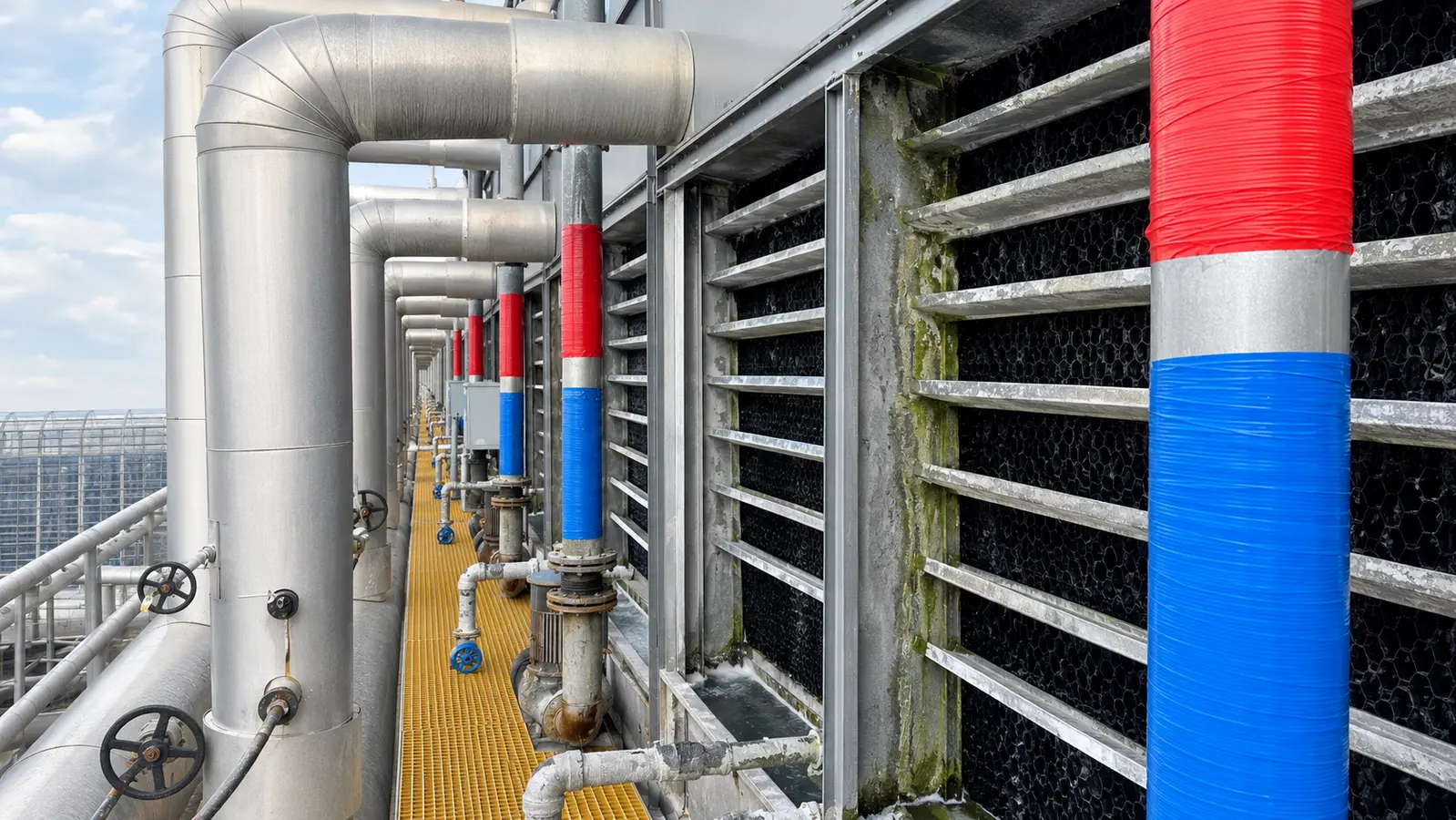 Pipework serving several cooling-tower units